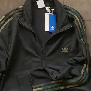 A brand new Adidas 2XL Track Jacket. Tags attached